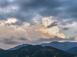 Image of clouds over a mountain landscape perfect for a church worship background