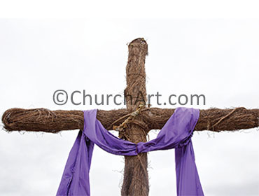 Cross of Christ draped with a purple robe photo