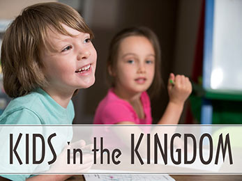 Church Art PowerPoint image of boy and girl coloring and caption Kids in the Kingdom