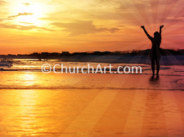 Person with upraised arms standing on beach and facing sunset as background illustration