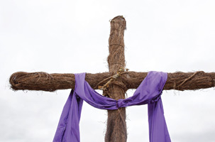 Christian Easter Photo of Wooden Cross and Purple Robe